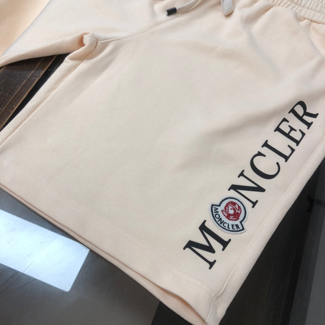 Stone Island cream shorts with side Moncler logo lettering