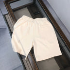 Stone Island cream shorts with elastic waistband and relaxed fit