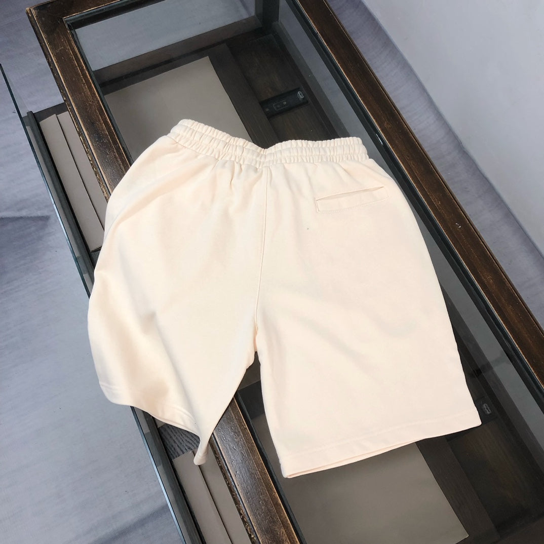 Stone Island cream shorts with elastic waistband and relaxed fit