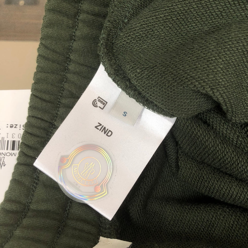 Dark green Moncler shorts with textured fabric and size S label