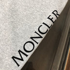 Back of heather gray drawstring shorts with large MONCLER text print