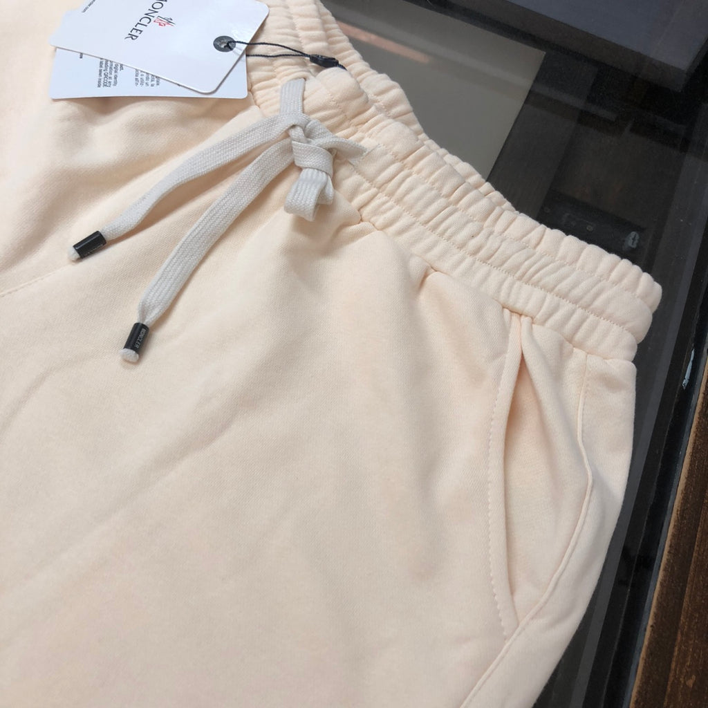 Moncler cream shorts close-up of elastic waistband and drawstring with knit ties
