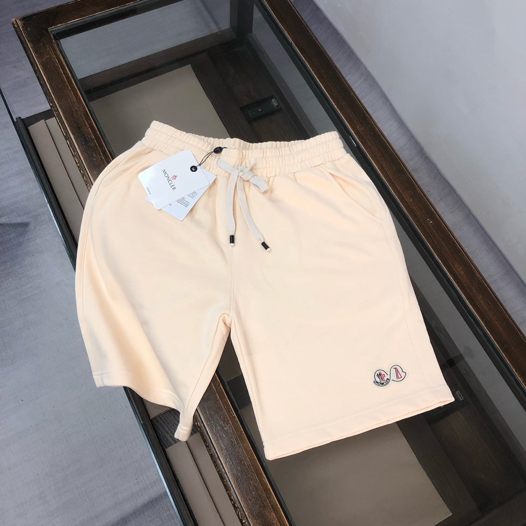 Moncler cream drawstring shorts with elastic waistband and small side logo patch