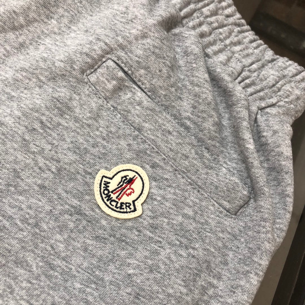 Gray shorts with Moncler logo patch on front pocket area
