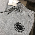 Gray shorts with elastic waistband, drawstring, and Moncler graphic patch
