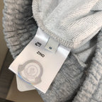 Gray shorts with ZIND tag and size M label attached