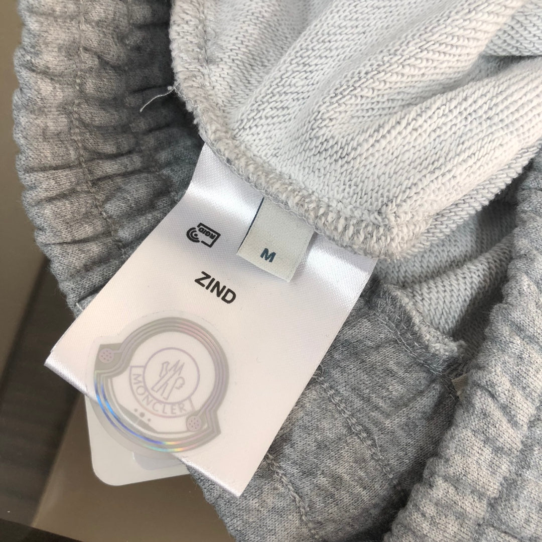 Gray shorts with ZIND tag and size M label attached