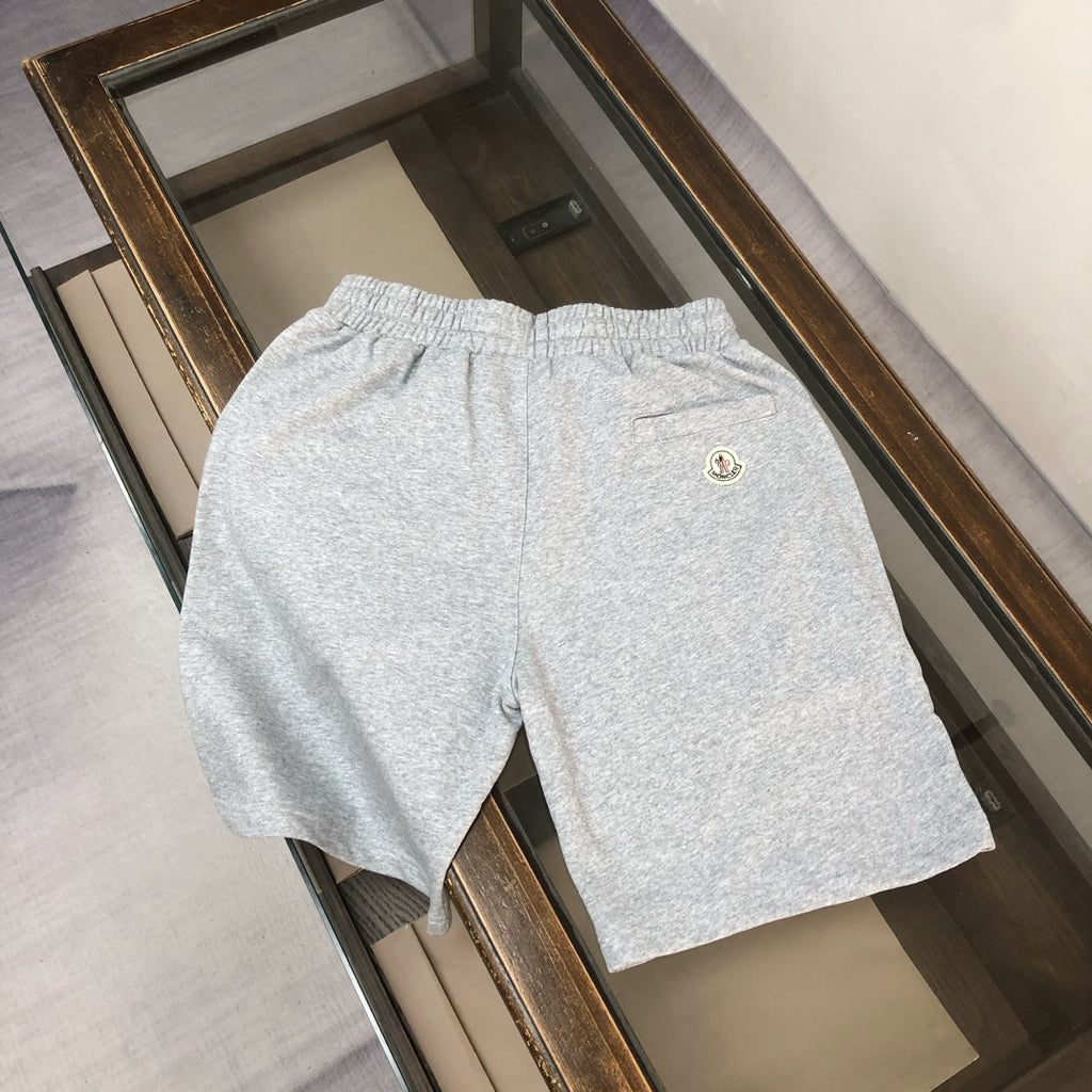 Gray heather shorts with elastic waistband and small Moncler logo on back