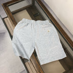 Gray heather shorts with elastic waistband and small Moncler logo on back