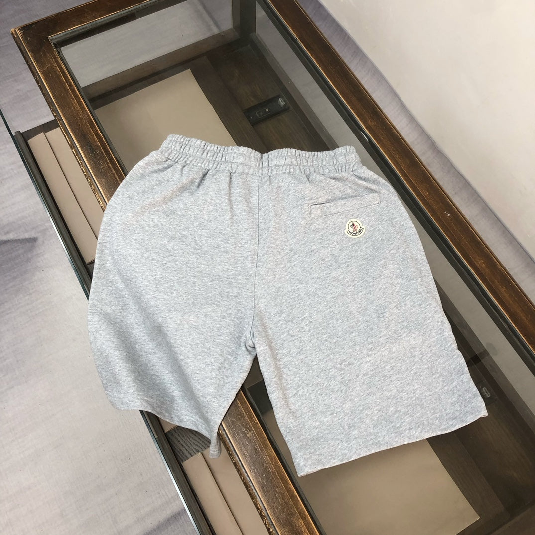 Gray heather shorts with elastic waistband and small Moncler logo on back
