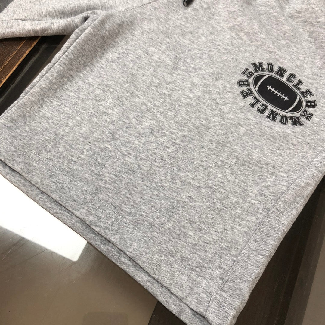 Gray shorts detail with Moncler round logo patch at side hem