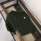 Stone Island dark green shorts with elastic waist and small chest logo