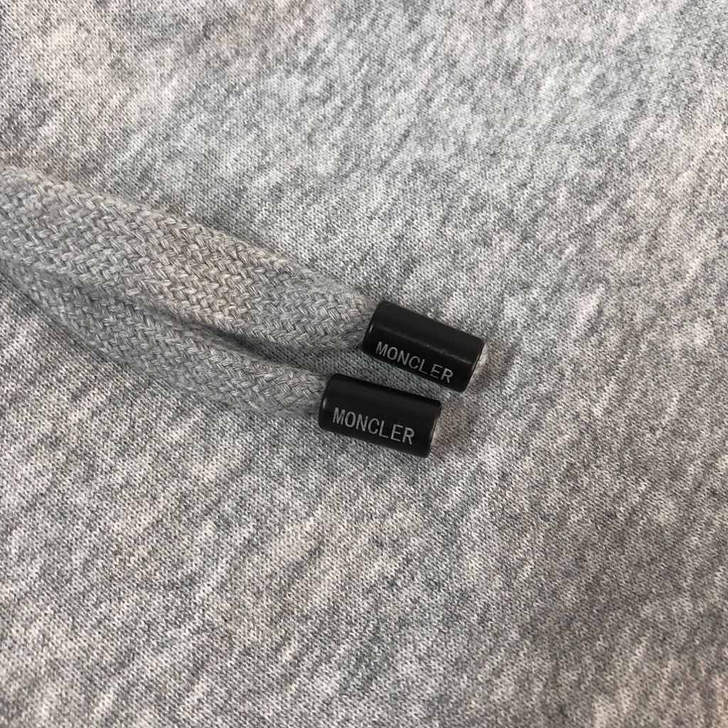 Gray shorts with Moncler label tabs on the inside waistband