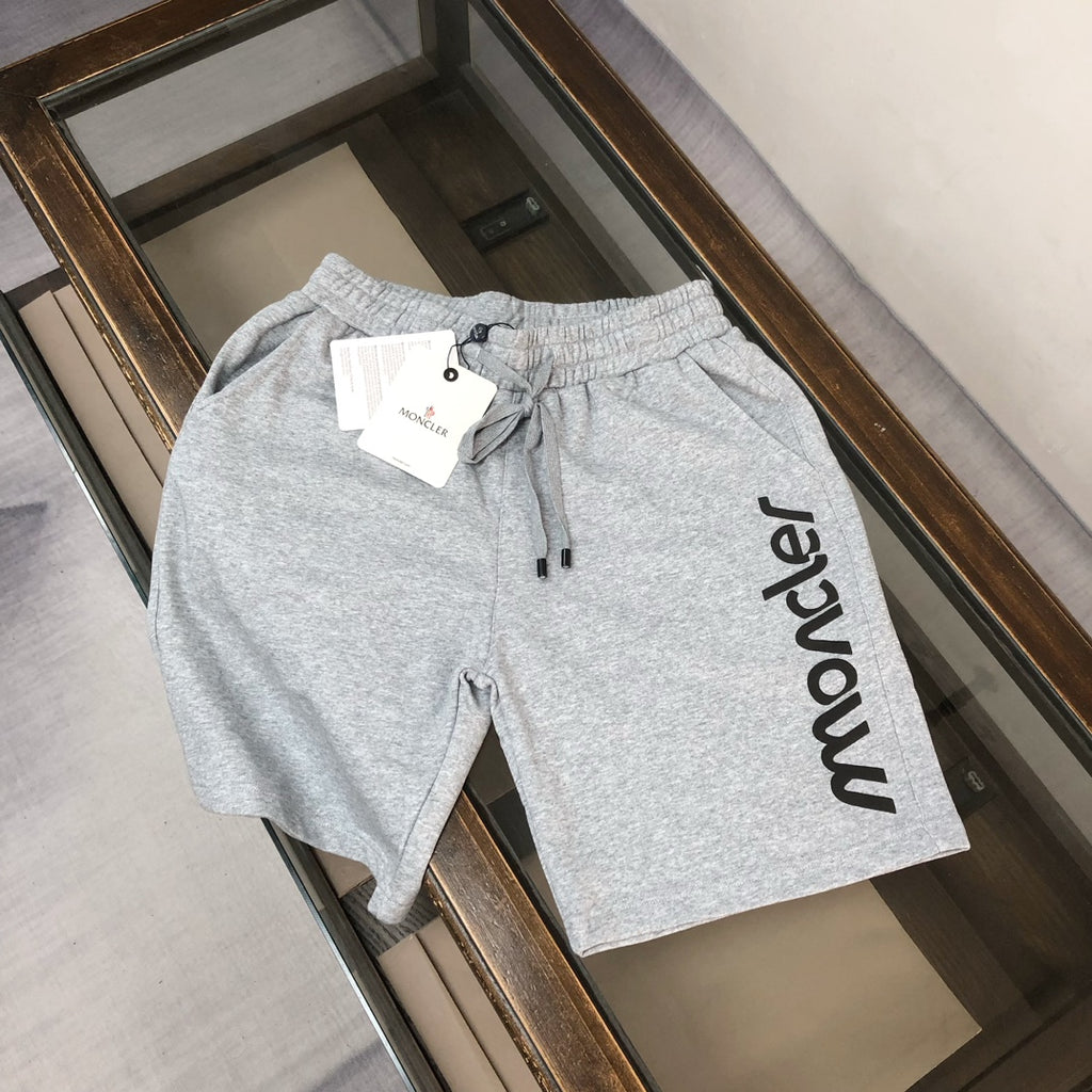 Light gray sweat shorts with elastic waist and drawstring, large Moncler side logo