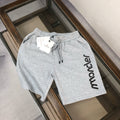 Light gray sweat shorts with elastic waist and drawstring, large Moncler side logo