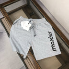 Light gray sweat shorts with elastic waist and drawstring, large Moncler side logo