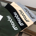 Stone Island drawstring shorts variety: black, cream and dark green with Moncler logo
