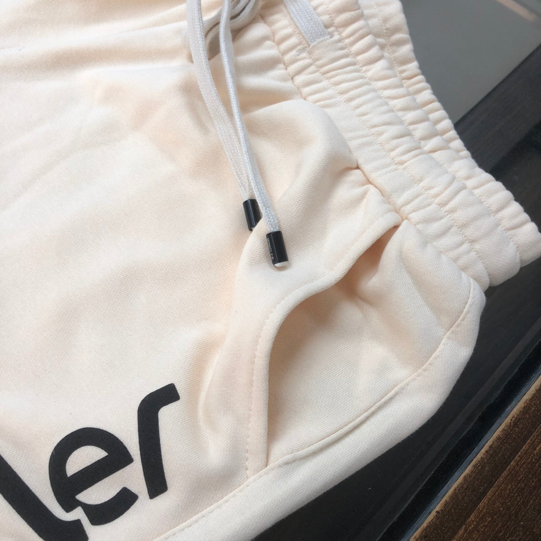 Stone Island cream shorts, elastic waistband and drawstring with black tips