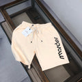 Stone Island drawstring shorts, cream with black Moncler logo and side pockets