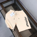 Stone Island drawstring shorts, cream with black Moncler logo and side pockets