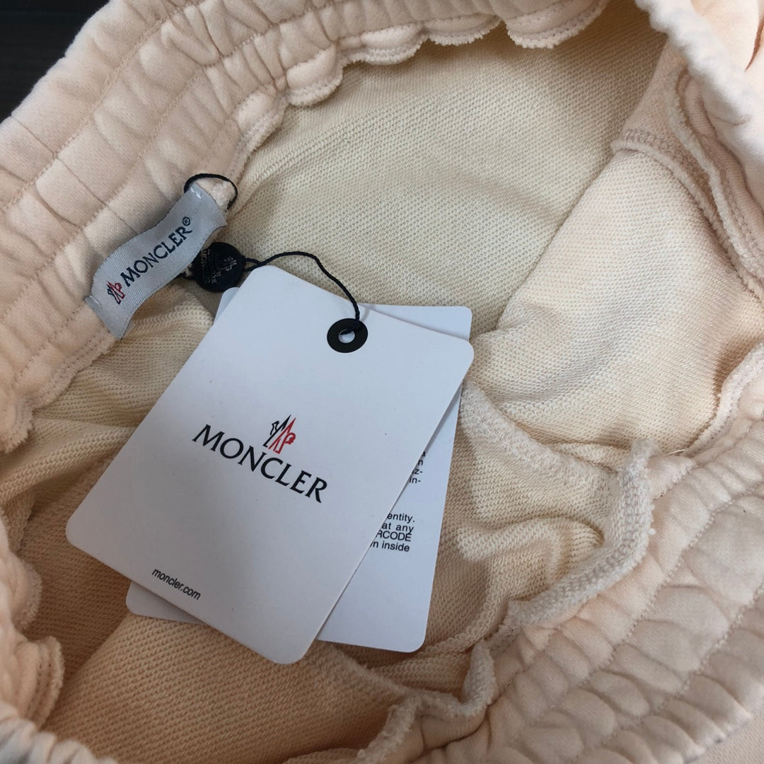 Stone Island shorts interior with quilted lining and hanging Moncler tag