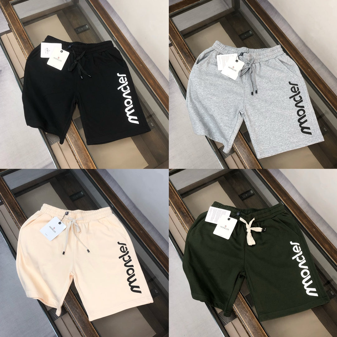 Set of four sweat shorts in black, light gray, beige, and dark green with Moncler logos