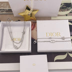 Dior accessory set of two silver-tone necklaces with CD rings and star charms