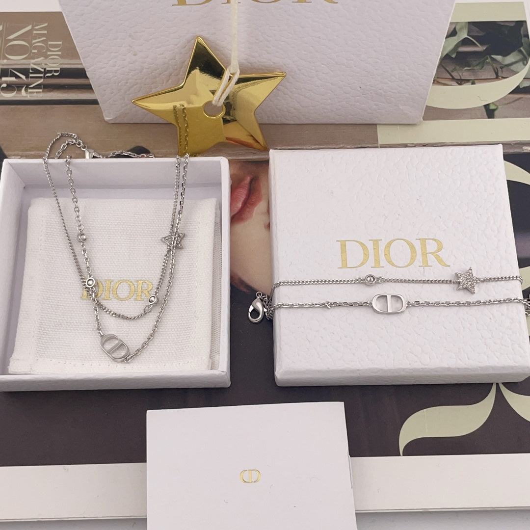 Dior accessory set of two silver-tone necklaces with CD rings and star charms