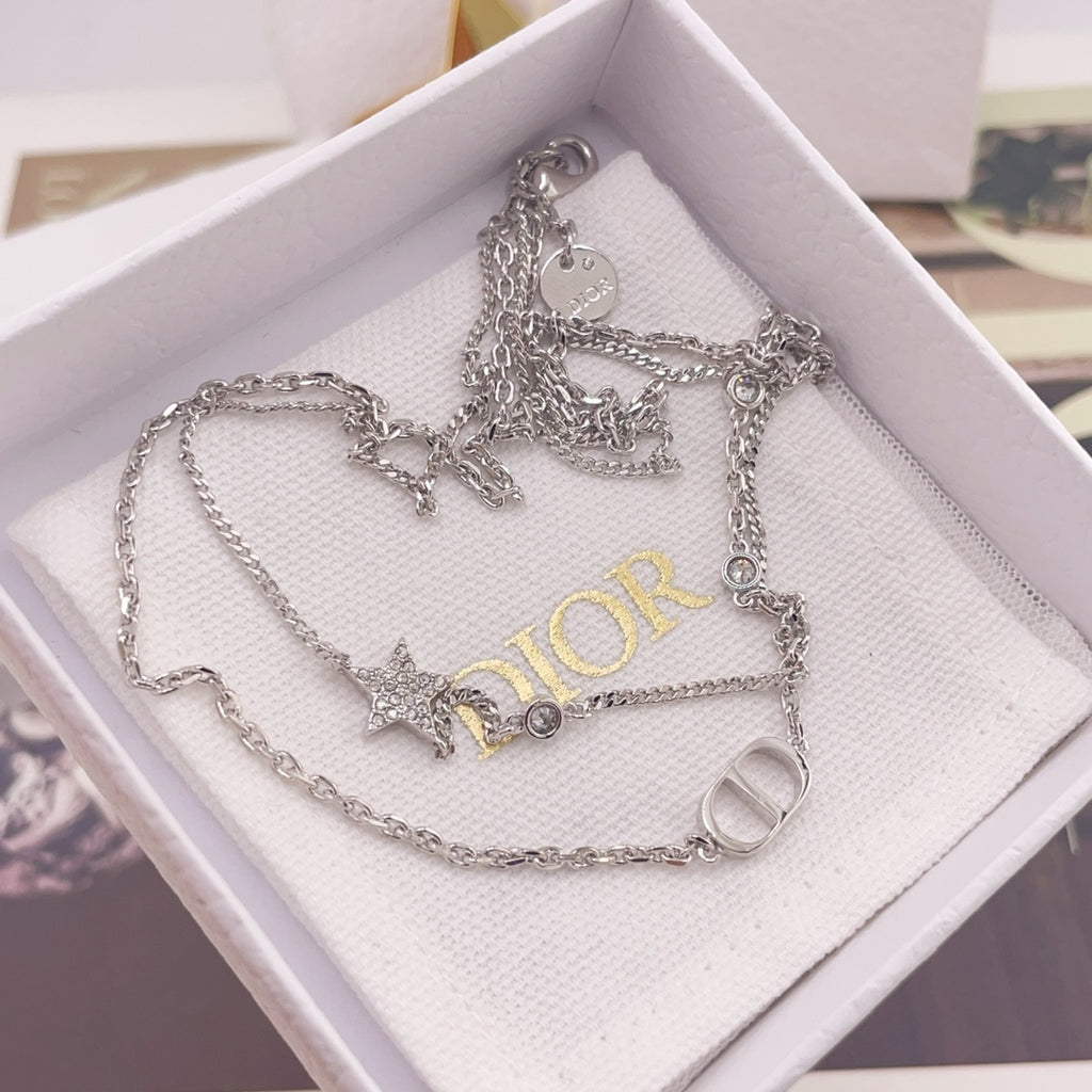 Silver-tone necklace set with star and CD ring charms in white jewelry box