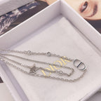 Silver-tone necklaces with star and CD pendant charms in white jewelry box
