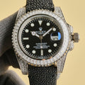 Rolex Submariner watch with black dial, black textured strap, jeweled bezel