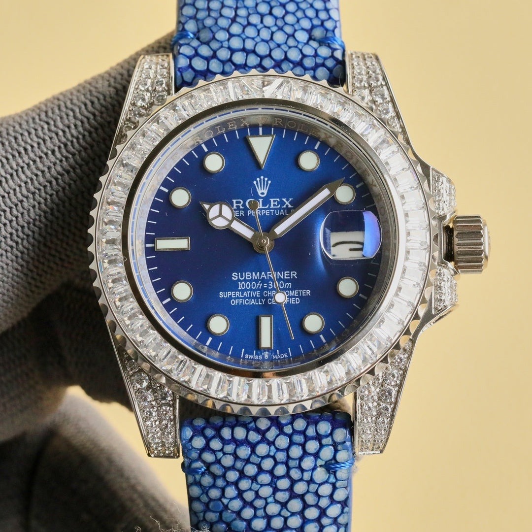 Rolex Submariner watch with blue dial, blue textured strap, diamond-studded bezel