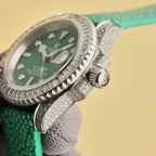 Rolex Submariner watch side view with green dial, diamond bezel, crown detail