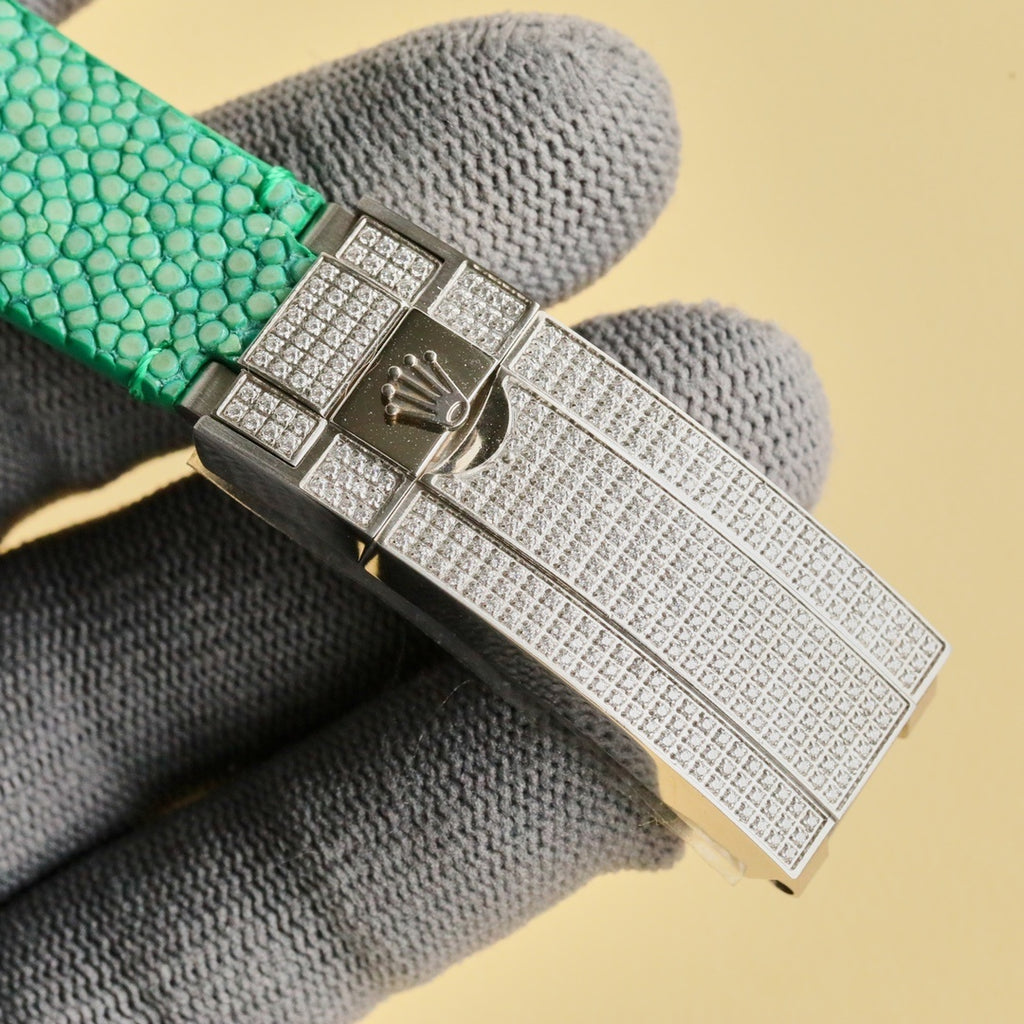 Rolex Submariner clasp with textured silver metal and diamond-like pattern