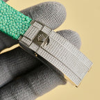 Rolex Submariner clasp with textured silver metal and diamond-like pattern