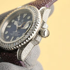 Rolex Submariner watch side view with black dial, diamond bezel, crown, purple leather strap