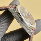 Rolex Submariner watch close-up, faceted diamond bezel edge, purple textured leather strap