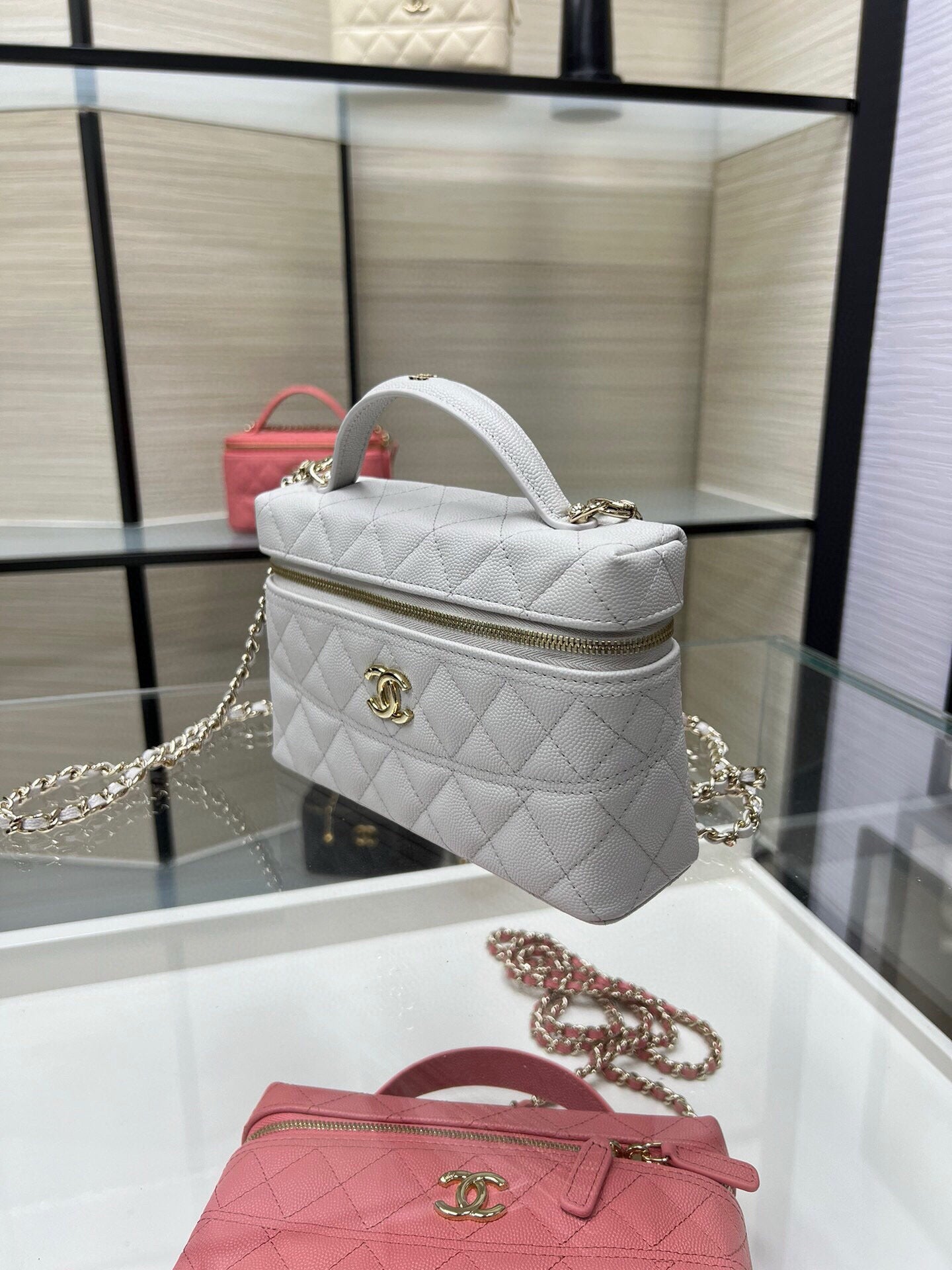Chanel quilted top-handle bag with chain strap, light gray with gold-tone hardware