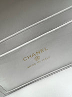 Chanel interior label: CHANEL and MADE IN ITALY on light gray leather