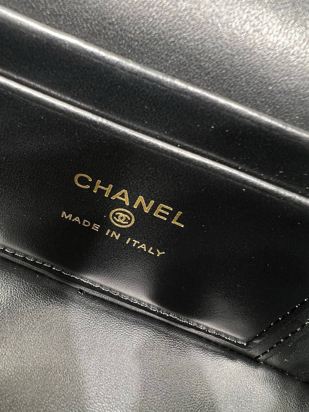 Chanel leather stamp reading CHANEL and MADE IN ITALY