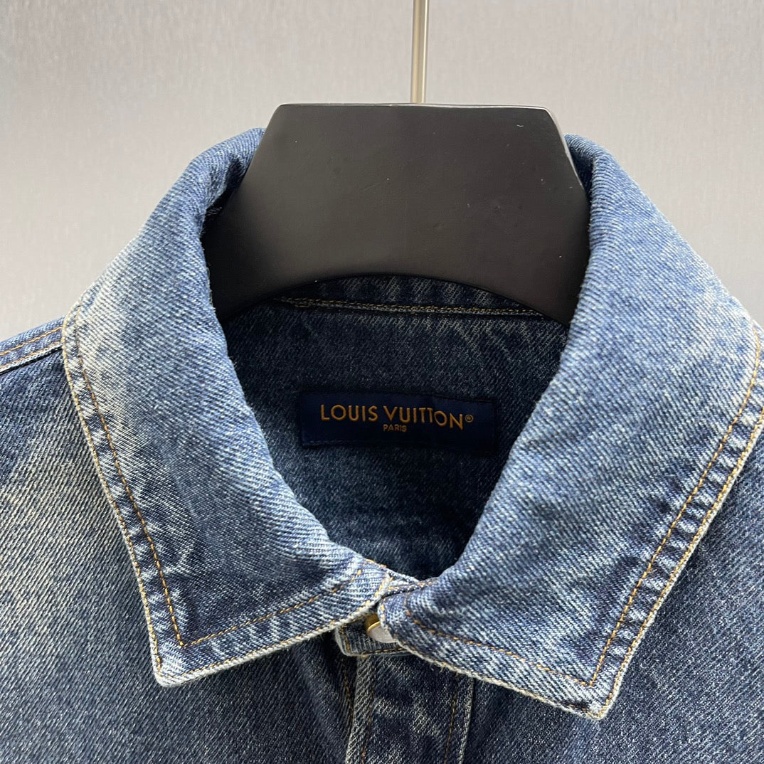 Denim jacket collar with Louis Vuitton label inside neckline