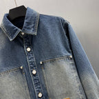 Blue denim jacket with pointed collar and front snap placket, chest patch pockets
