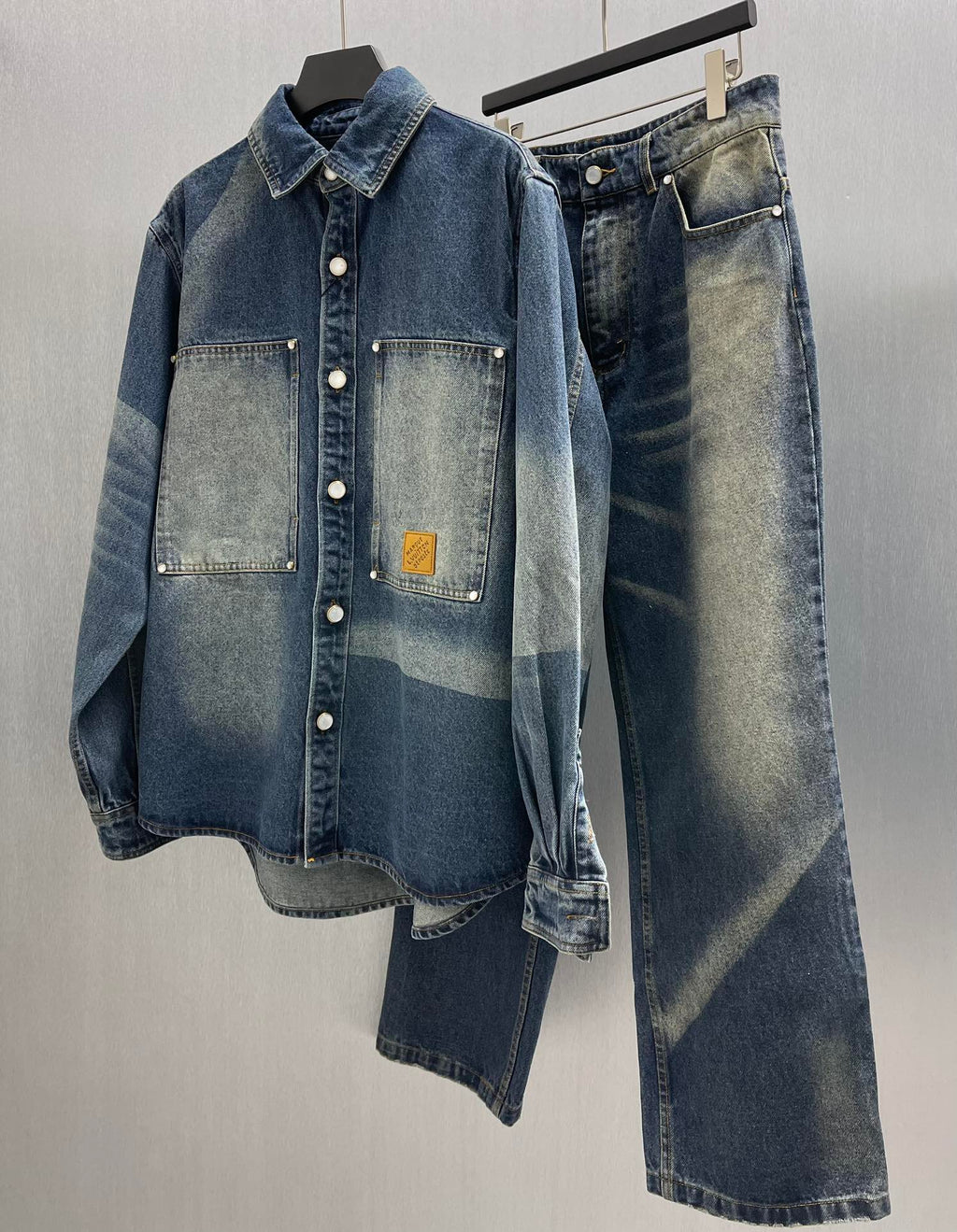 Denim jacket and jeans set with button-up top, flap pockets, and matching pants