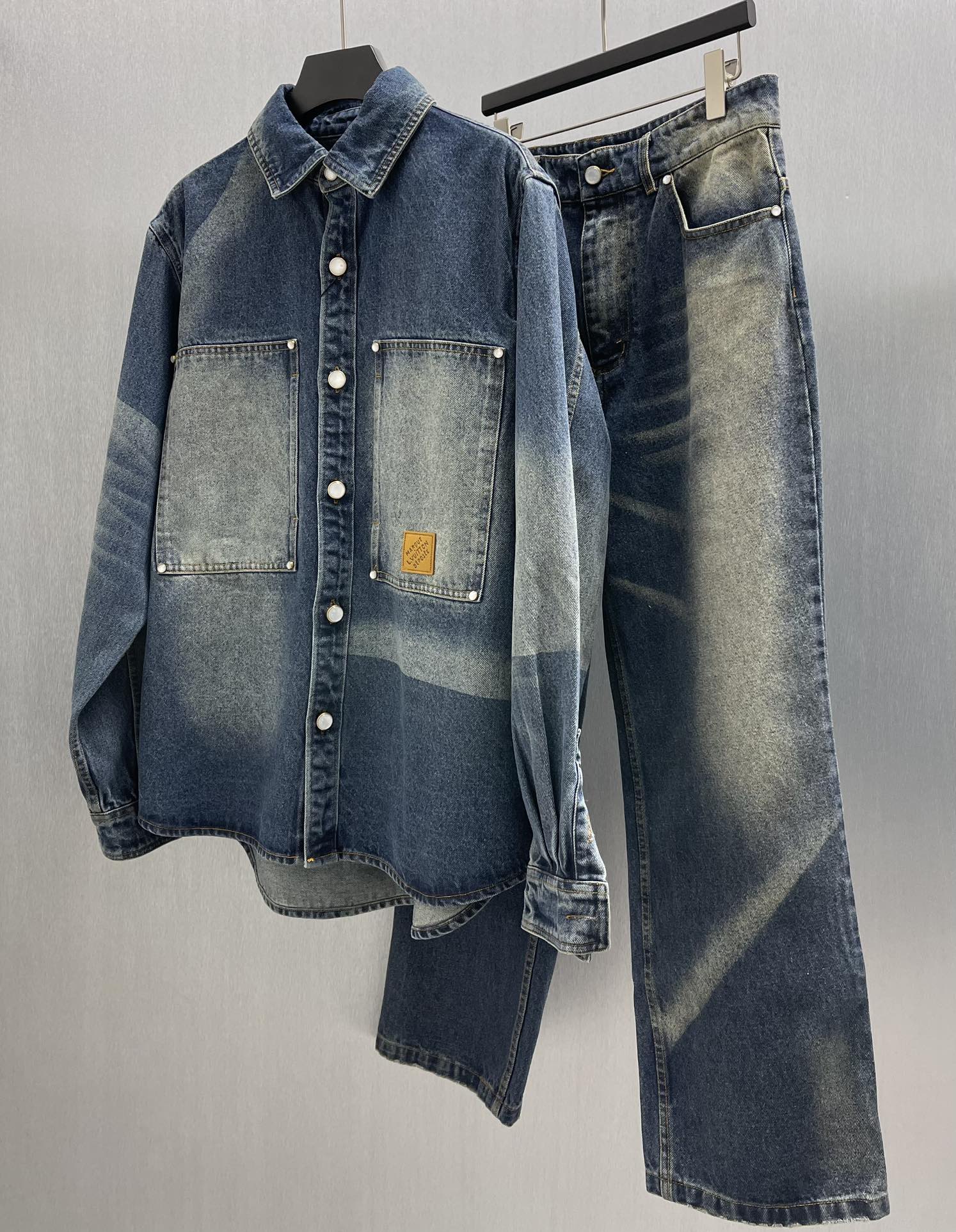 Denim jacket and jeans set with button-up top, flap pockets, and matching pants