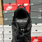 Black Balenciaga running shoe heel with raised BALENCIAGA lettering
