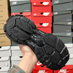 Black Balenciaga running shoe outsole with traction tread and herringbone pattern