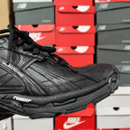 Black Balenciaga running shoe with textured leather panels and chunky outsole
