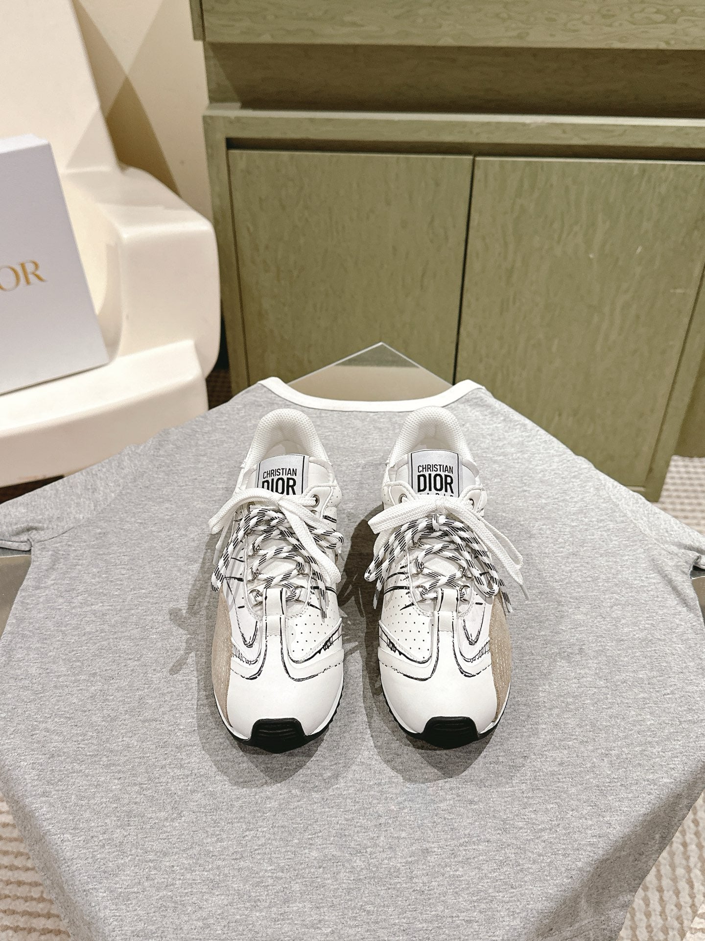 Dior unisex sneakers, white leather with black soles and lace-up design
