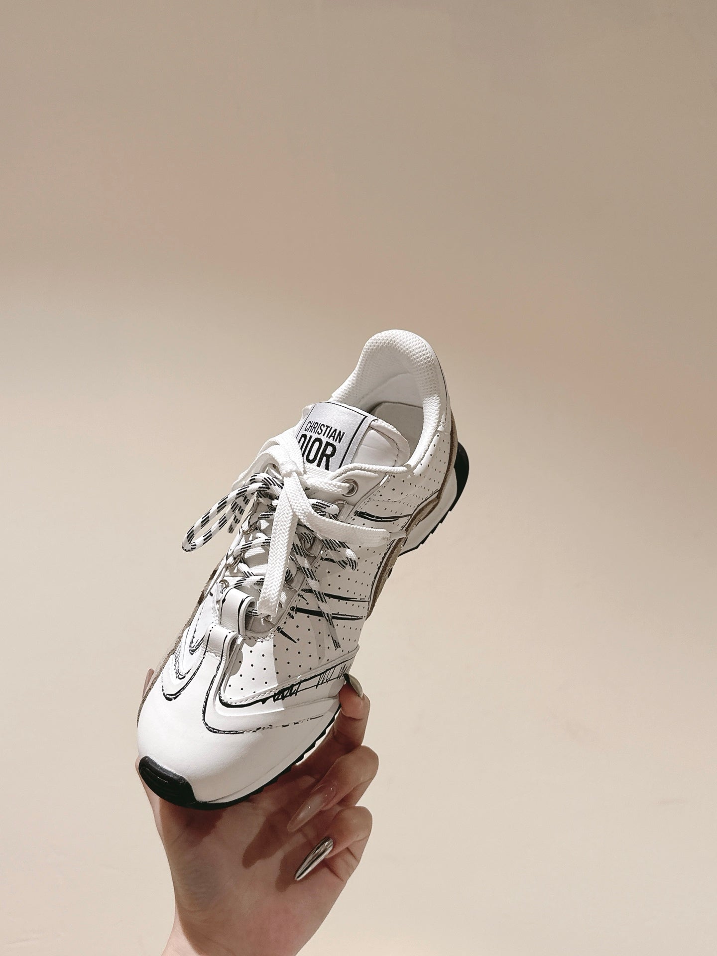 Dior unisex sneaker, white leather with black sole and Dior logo on tongue
