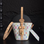 Louis Vuitton monogram bucket bag with tan leather trim and colorful logo pattern